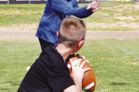 Learning football skills at camp